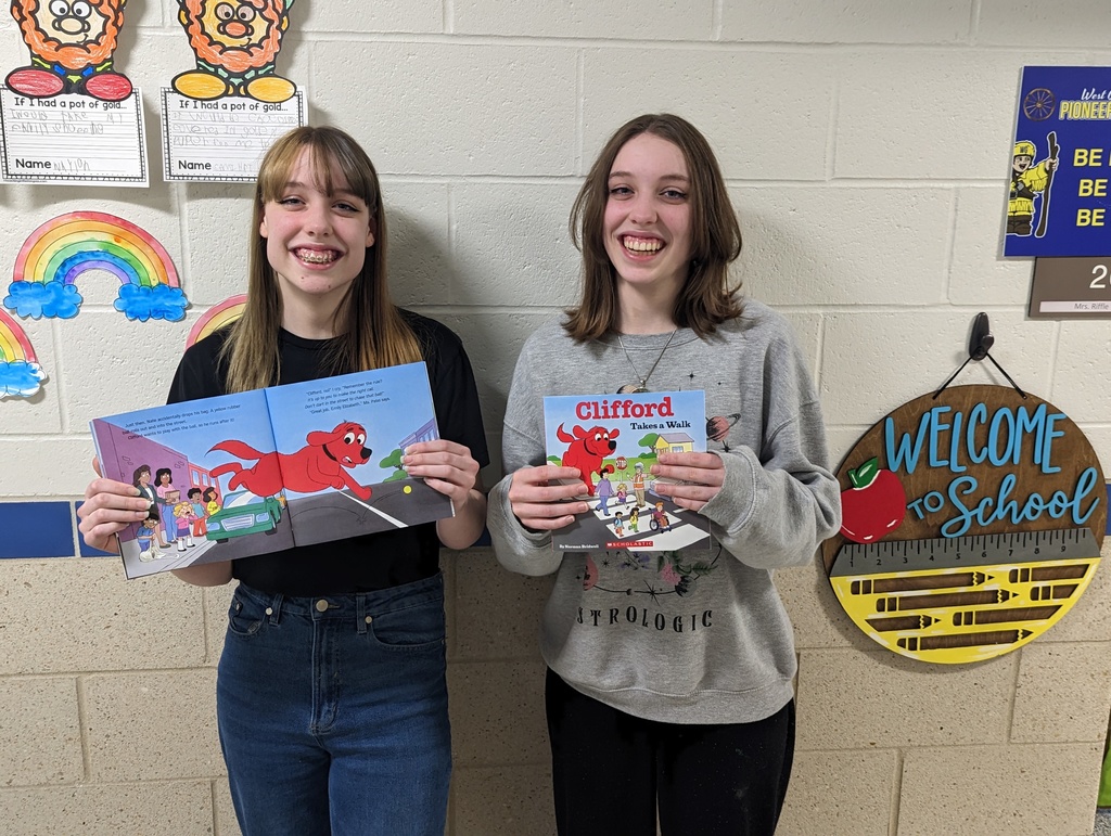 Youth Traffic Safety Council members, Isabella and Elizabeth Cunningham, take part in Read Across America Week, reading a Clifford Story about walking around roadways safely.